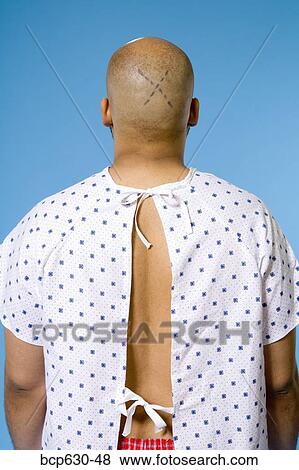 Stock Photo - facing away, healthcare, gown, african ethnicity. Fotosearch
