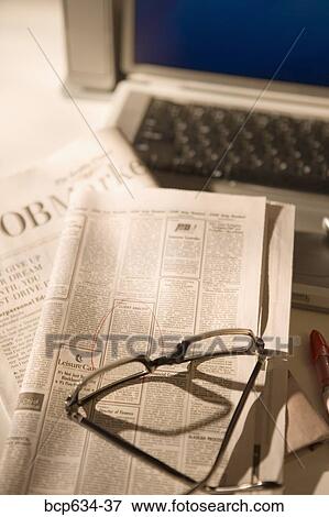 Stock Photo - inside, circle, high angle, finance, eyeglasses, advertisement. Fotosearch