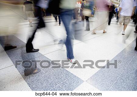 Blurred view of people walking through Liverpool Street Station, London, United Kingdom View Large Photo Image Picture - Blurred view of people walking through Liverpool Street Station, London, United Kingdom . Fotosearch