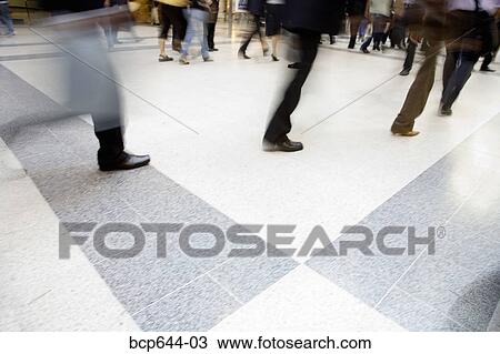 Blurred view of people walking through Liverpool Street Station, London, United Kingdom View Large Photo Image Stock Image - Blurred view of people walking through Liverpool Street Station, London, United Kingdom . Fotosearch
