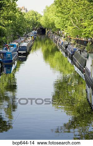 Picture - Boats lining riverbanks, London, United Kingdom. Fotosearch