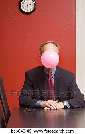 Stock Photo - Businessman blowing a bubble. Fotosearch