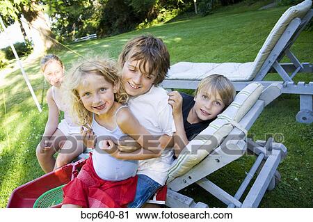Children playing in the backyard View Large Photo Image Stock Image - Children playing in the backyard. Fotosearch