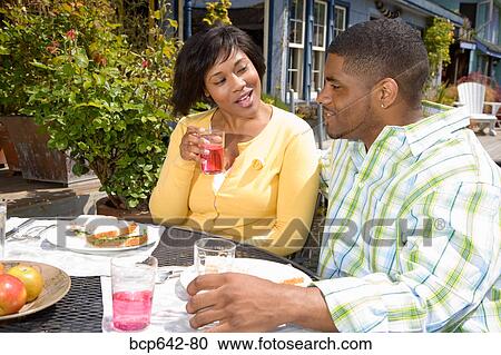 Couple eating outdoors View Large Photo Image Stock Image - Couple eating outdoors. Fotosearch