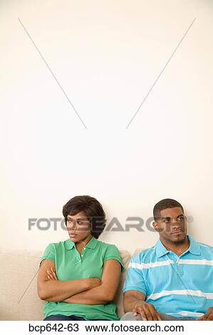 Stock Image - Couple ignoring each other. Fotosearch
