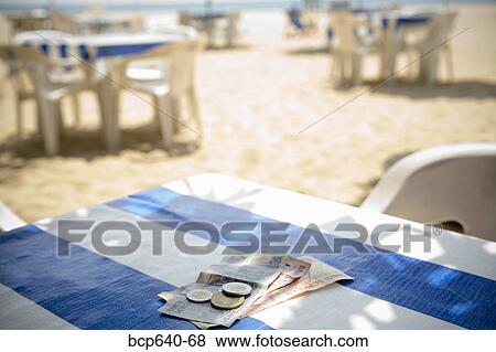 Stock Photo - Foreign currency on table. Fotosearch