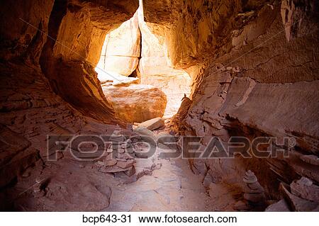 Stock Image - Light shining into cave. Fotosearch