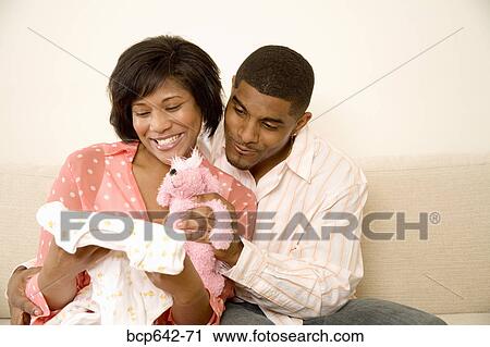 Man giving his girlfriend gifts View Large Photo Image Stock Image - Man giving his girlfriend gifts. Fotosearch