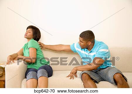 Man reaching out to indignant girlfriend View Large Photo Image Stock Image - Man reaching out to indignant girlfriend. Fotosearch