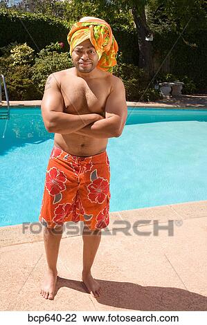 Man wearing towel turban by pool View Large Photo Image Stock Image - Man wearing towel turban by pool. Fotosearch