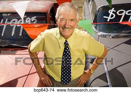 Picture - Used car salesman and cars. Fotosearch
