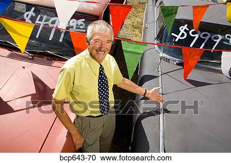 Used car salesman and cars View Large Photo Image Stock Image - Used car salesman and cars. Fotosearch