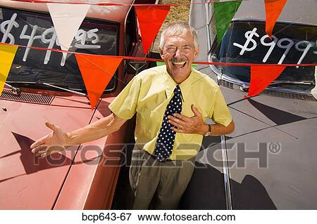 Used car salesman and cars View Large Photo Image Stock Photo - Used car salesman and cars. Fotosearch