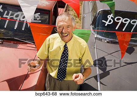 Used car salesman and cars View Large Photo Image Stock Photo - Used car salesman and cars. Fotosearch