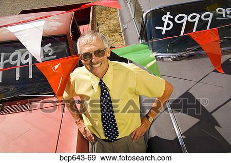 Used car salesman and cars View Large Photo Image Stock Photo - Used car salesman and cars. Fotosearch