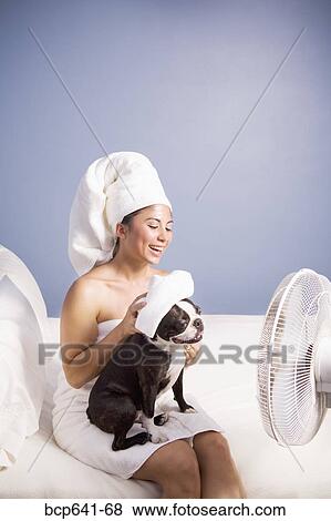 Woman drying herself and her dog by fan View Large Photo Image Stock Photo - Woman drying herself and her dog by fan. Fotosearch