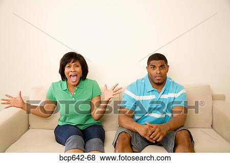 Woman screaming beside her boyfriend View Large Photo Image Stock Photo - Woman screaming beside her boyfriend. Fotosearch