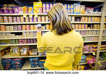 Woman shopping in supermarket View Large Photo Image Picture - Woman shopping in supermarket. Fotosearch