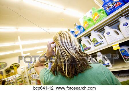 Woman shopping in supermarket View Large Photo Image Stock Image - Woman shopping in supermarket. Fotosearch
