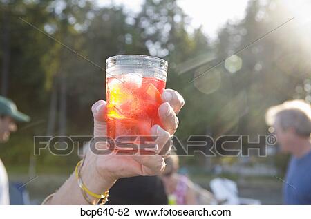 Woman’s hand holding cocktail View Large Photo Image Stock Image - Woman’s hand holding cocktail. Fotosearch