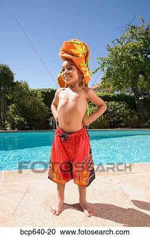 Young boy wearing towel turban by pool View Large Photo Image Stock Image - Young boy wearing towel turban by pool. Fotosearch