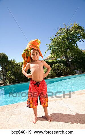 Young boy wearing towel turban by pool View Large Photo Image Stock Photo - Young boy wearing towel turban by pool. Fotosearch