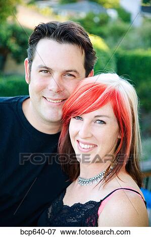 Stock Photo - Young couple smiling together. Fotosearch
