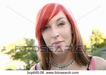 Young woman with dyed hair smiling View Large Photo Image Stock Photograph - Young woman with dyed hair smiling. Fotosearch