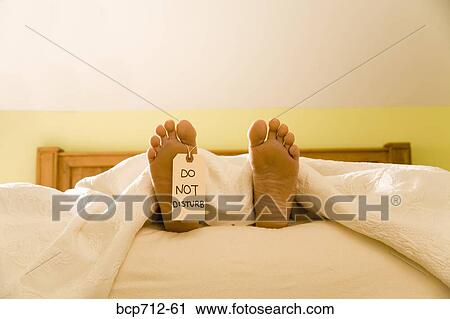 Bare feet with Do Not Disturb sign View Large Photo Image Stock Image - Bare feet with Do Not Disturb sign. Fotosearch