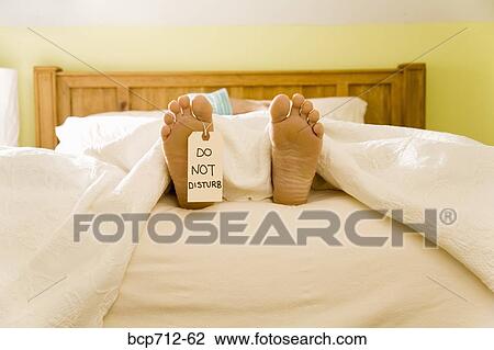 Bare feet with Do Not Disturb sign View Large Photo Image Stock Image - Bare feet with Do Not Disturb sign. Fotosearch