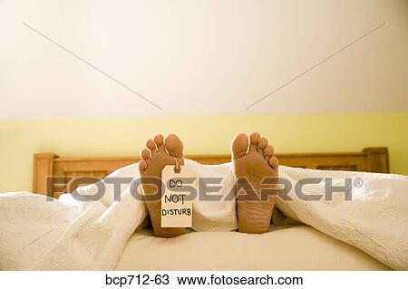 Bare feet with Do Not Disturb sign View Large Photo Image Stock Image - Bare feet with Do Not Disturb sign. Fotosearch