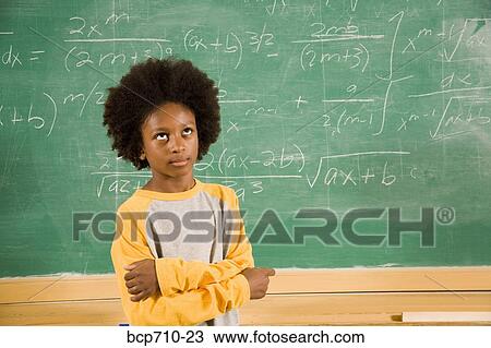 Boy rolling eyes in front of math on blackboard View Large Photo Image Stock Image - Boy rolling eyes in front of math on blackboard. Fotosearch