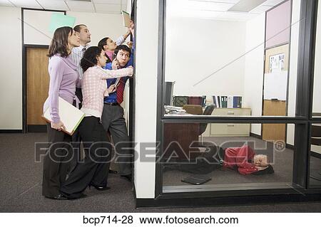 Businessman sleeping while co-workers knock on door View Large Photo Image Stock Photo - Businessman sleeping while co-workers knock on door. Fotosearch