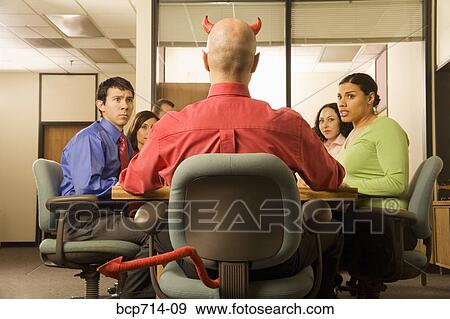 Businessman with devil horns and tail at meeting View Large Photo Image Stock Photo - Businessman with devil horns and tail at meeting. Fotosearch