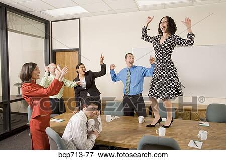 Businesspeople acting silly in office View Large Photo Image Stock Photo - Businesspeople acting silly in office. Fotosearch