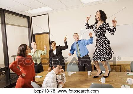 Businesspeople acting silly in office View Large Photo Image Stock Photo - Businesspeople acting silly in office. Fotosearch