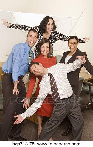 Businesspeople acting silly in office View Large Photo Image Stock Photography - Businesspeople acting silly in office. Fotosearch