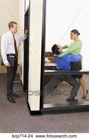 Picture - Businesspeople dancing in office. Fotosearch