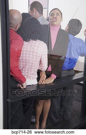 Businesswoman pushing up against glass wall View Large Photo Image Stock Photograph - Businesswoman pushing up against glass wall. Fotosearch