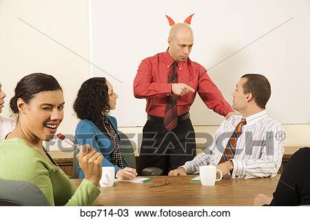 Businesswoman smiling about boss with horns over head View Large Photo Image Stock Image - Businesswoman smiling about boss with horns over head. Fotosearch