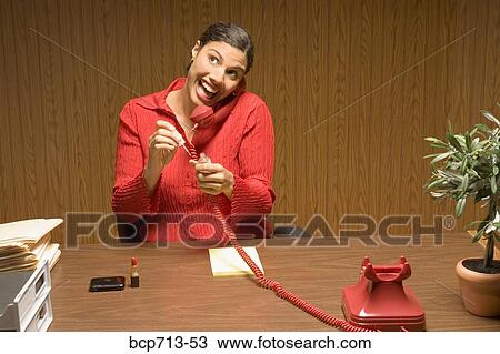 Businesswoman talking on telephone and painting fingernails View Large Photo Image Stock Image - Businesswoman talking on telephone and painting fingernails. Fotosearch