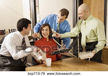 Stock Photo - Businesswoman with three male assistants. Fotosearch