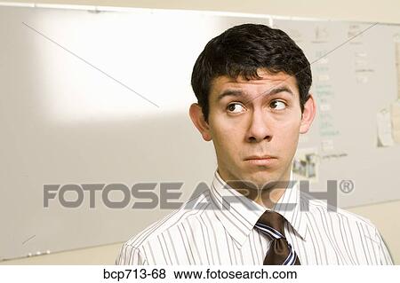Close up of businessman looking sideways View Large Photo Image Stock Photo - Close up of businessman looking sideways. Fotosearch