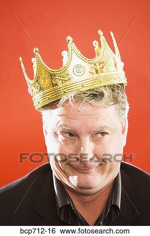 Close up of businessman wearing gold crown View Large Photo Image Stock Photograph - Close up of businessman wearing gold crown. Fotosearch
