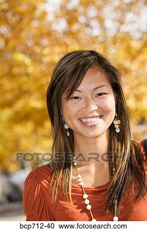 Close up of woman smiling outdoors View Large Photo Image Stock Image - Close up of woman smiling outdoors. Fotosearch