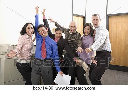 co-workers cheering next to photocopier machine View Large Photo Image Stock Photograph - co-workers cheering next to photocopier machine. Fotosearch