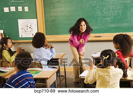 Female teacher asking student a question View Large Photo Image Stock Photo - Female teacher asking student a question. Fotosearch