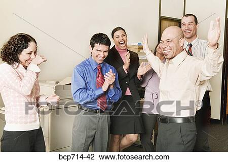 Group of co-workers clapping for businessman View Large Photo Image Stock Image - Group of co-workers clapping for businessman. Fotosearch