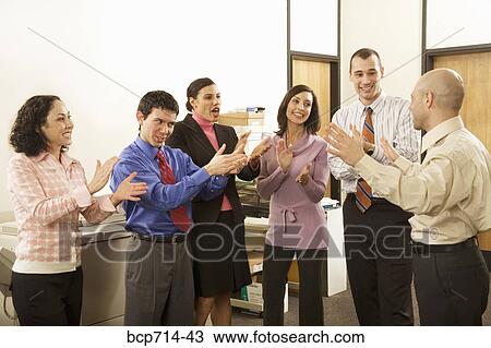Group of co-workers clapping for businessman View Large Photo Image Stock Image - Group of co-workers clapping for businessman. Fotosearch