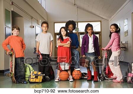 Group of students with sports equipment in hallway View Large Photo Image Stock Image - Group of students with sports equipment in hallway. Fotosearch